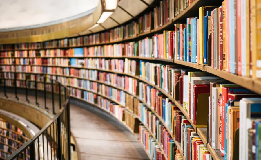 Rows of books on shelves in a library