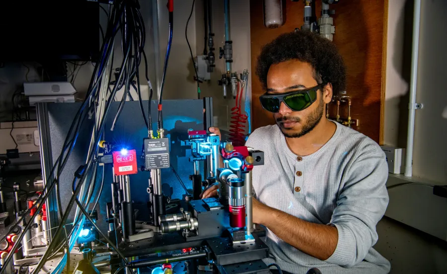 Performing experimental study of optical phase change materials using lasers to switch their response between crystalline and amorphous states.