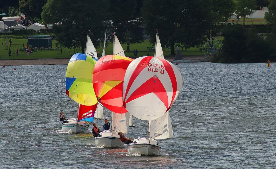 3 sailing boats with spinnakers in a line
