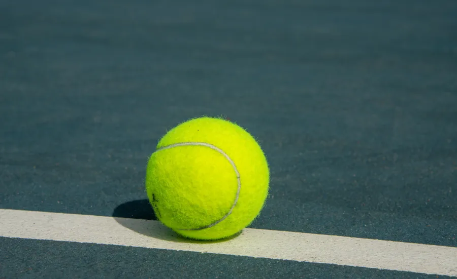 Tennis ball on tennis court