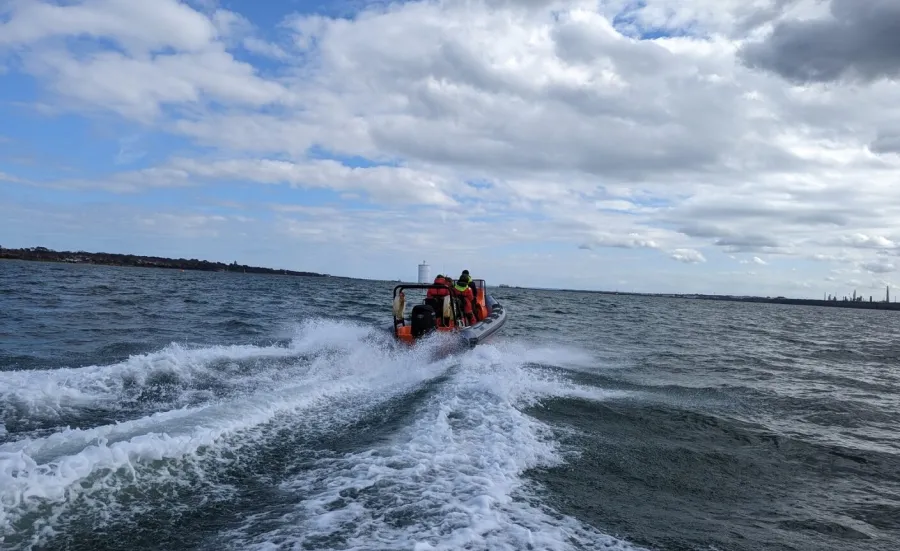 Powerboat speeding away from the camera