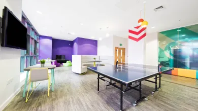 Orion Point common room including TV's, seating and a table tennis table