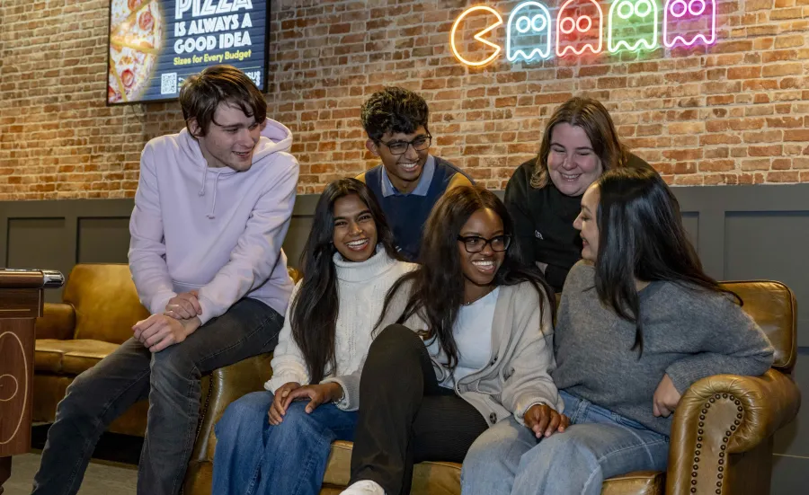 A group of students sitting on a sofa in the students union