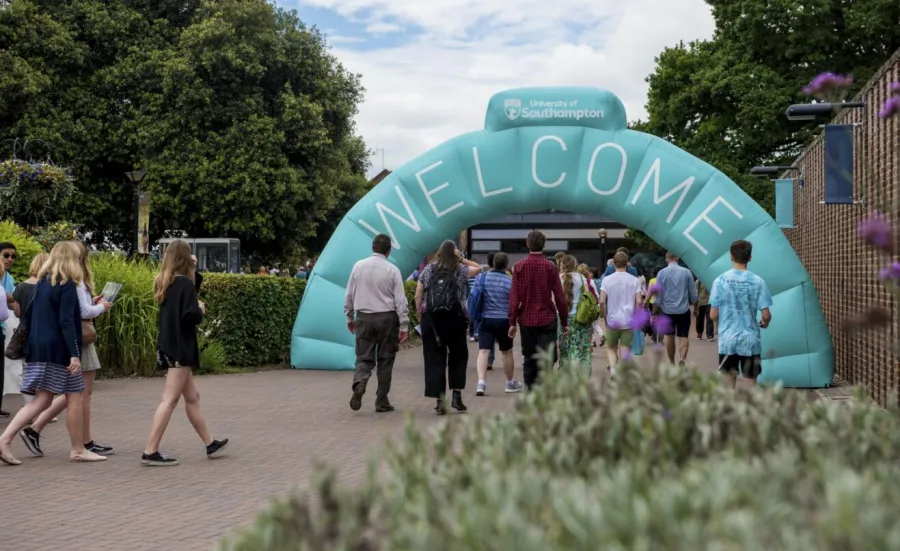 Visitors walking through the inflatable welcome arch on Highfield campus