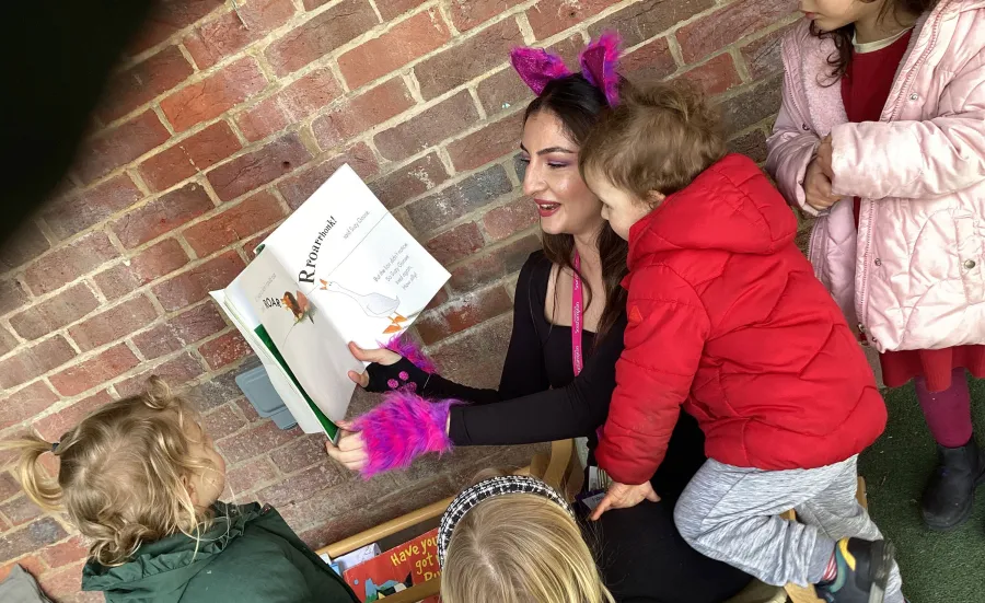 Staff of the Early Years Centre with children