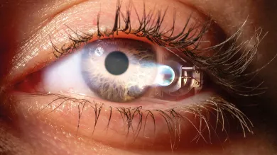 A close-up image of an eye, reflecting a jet propulsion device.