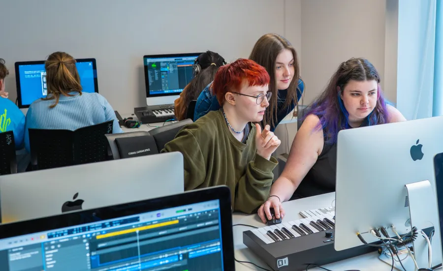 MA International Music Management students working on music on computer
