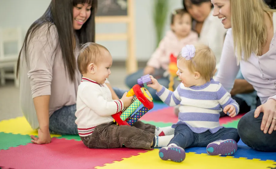 Parents playing with their children