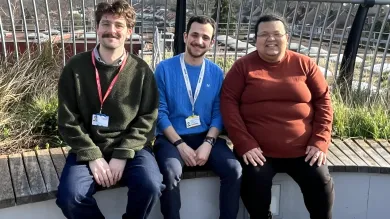 Members of GIBD sitting on a bench together