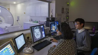 Researchers Angela and Kai review the resulults of an MRI brainscan
