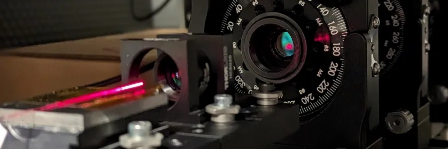 Light trapped in and guided along the air filled core of a hollow-core fiber by thin, glass-based, hollow cylinders that act like the bars of a cage.
