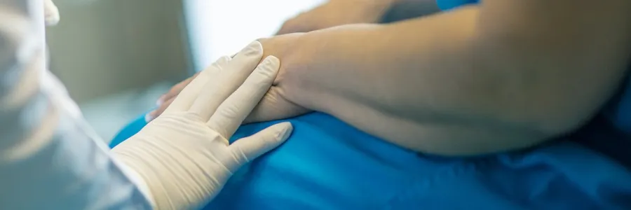 A doctor reassures a patient