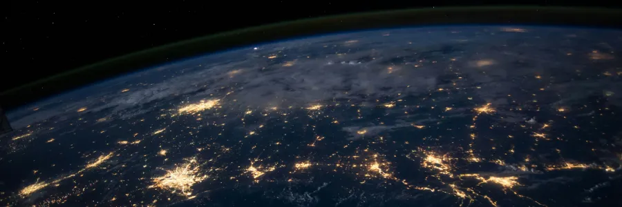 A dark aerial view of earth from outer space