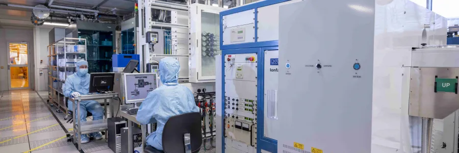 Researchers wearing cleanroom suits in the nanofabrication cleanrooms 