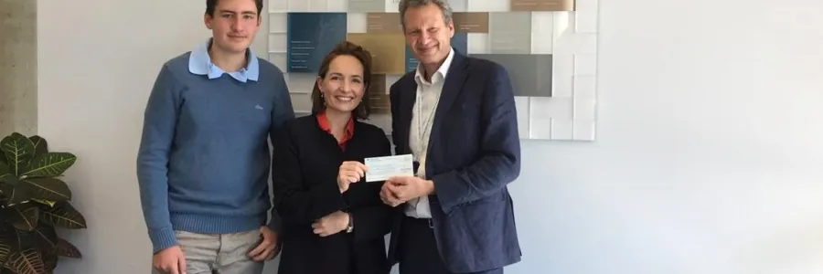 Liza recieving a cheque