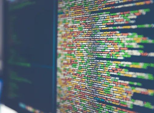 Java coding in different colours on an angled computer screen