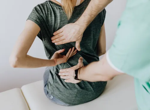 Image showing a person visiting a doctor with back pain 
