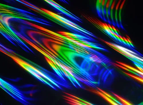 Holographic patterns of light against a black background