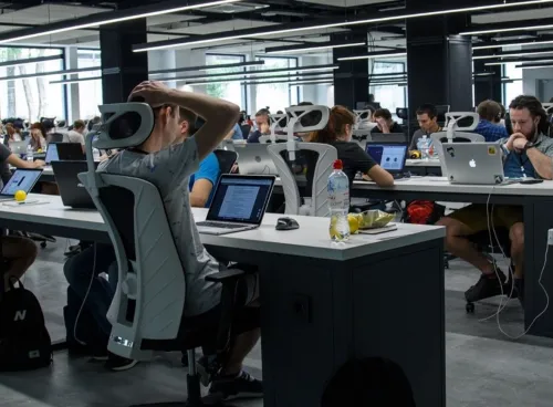 Workers in a digital technology company working in an open-plan office space