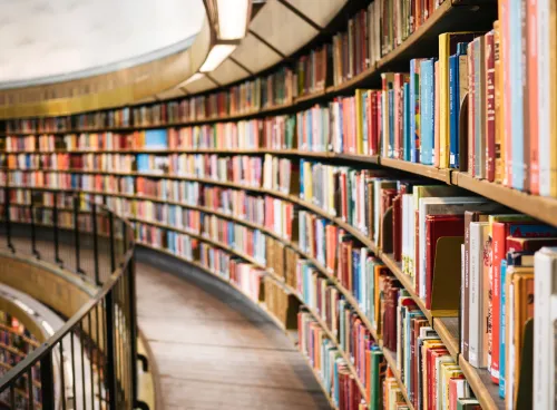 Rows of books on shelves in a library