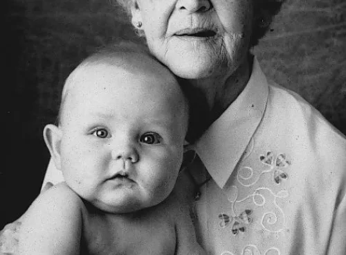 An old woman with a baby on her arms
