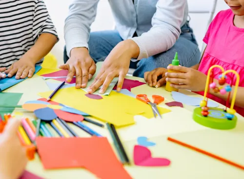 Children playing with toys and arts and crafts