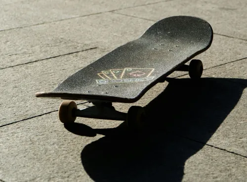 Skateboard on patio in sunshine