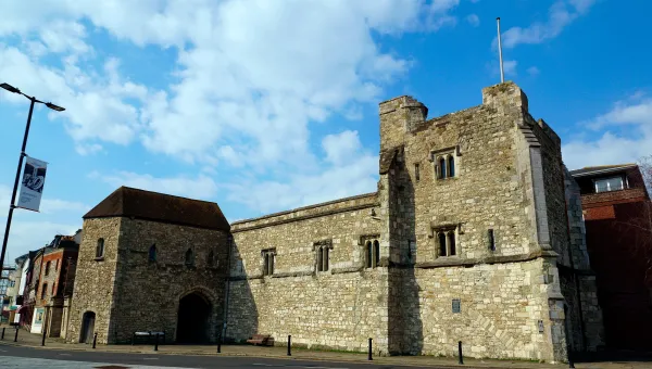 Outside view of the grey stone walls of God's Tower.