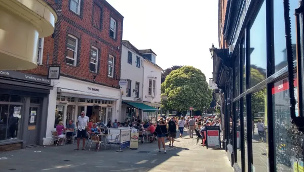 Restaurants with outdoor tables on a Winchester street. 