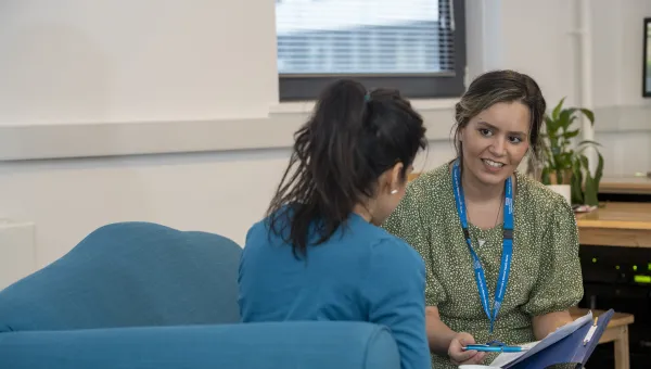 Adviser and student in conversation. 