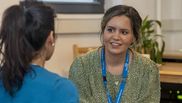 Adviser and student in conversation. 