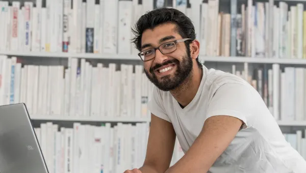 accelerated law degree student working on his laptop