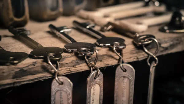 Row of old fashioned keys with labels.
