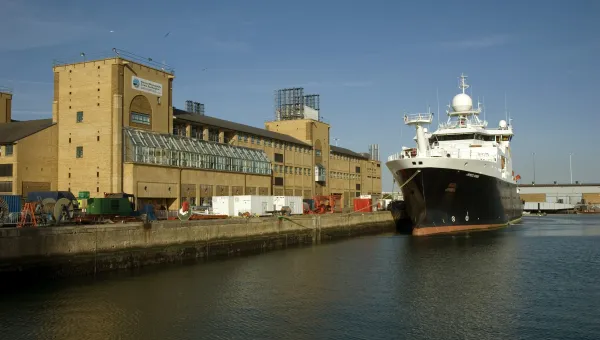 Waterfront Campus and the surrounding docks and boats on a sunny day.