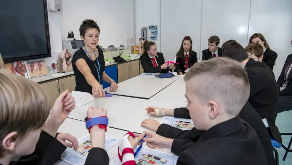 Teaching explaining part of a health lesson to school pupils