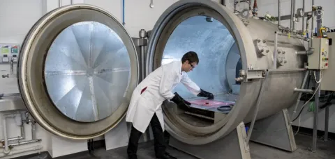 A student at work in the testing and structures research lab