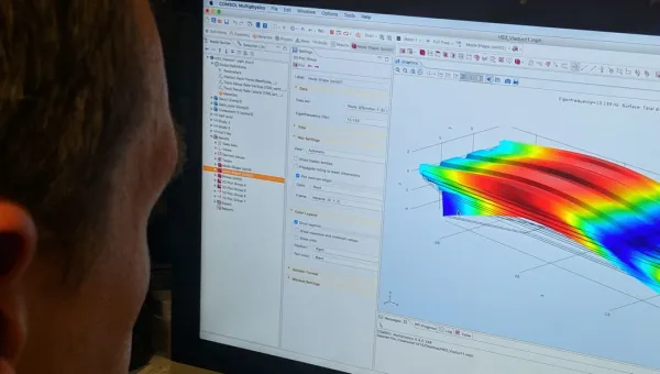 An over-the-shoulder view of a computer monitor displaying data from a recent round of acoustics experimentation.