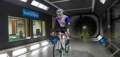 Cyclist takes part in an aerodynamics experiment in the R J Mitchell wind tunnel