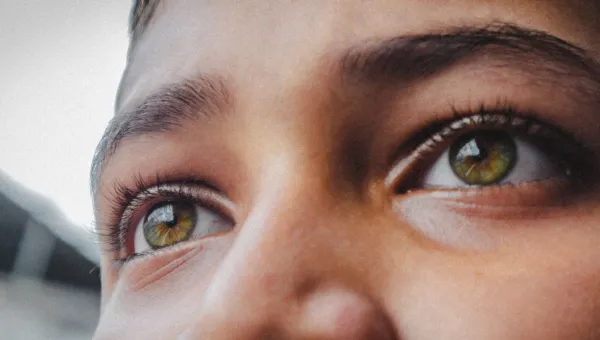 Close up of a young person's eyes looking into the distance