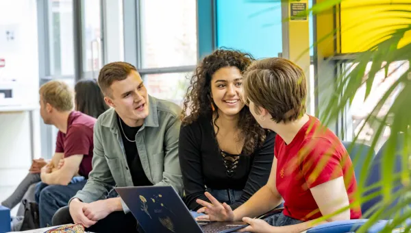 Modern Language students sharing laptop 