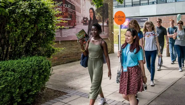 A student shows a group of visitors around Highfield campus