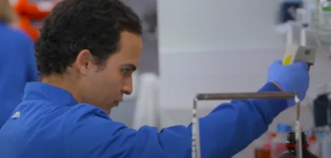 PhD student, David Arcia, conducting research in a laboratory.