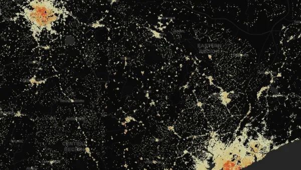 A data visualisation of population densities in Ghana from a WorldPop online map, showing that while there are two larger centres of population, there are inhabited areas covering less land scattered across most of the country, some following what appear to be roads