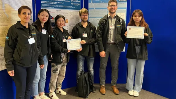 Group of people posing with their certificates