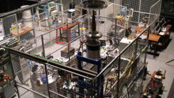 Large cage containing commercial testing equipment