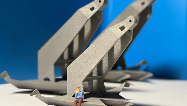 3D printed model of a man sitting on the edge of a huge metal structure