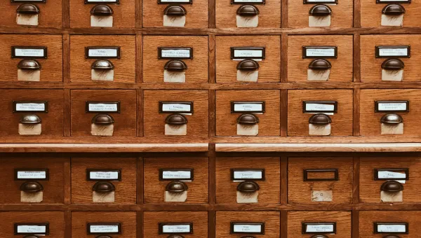 A block of wooden card catalogue drawers