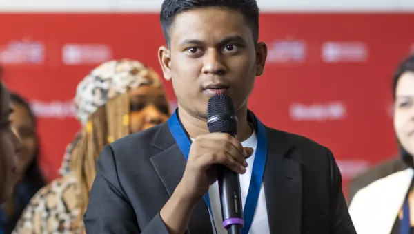 International student Karthik Saravan presenting at a conference