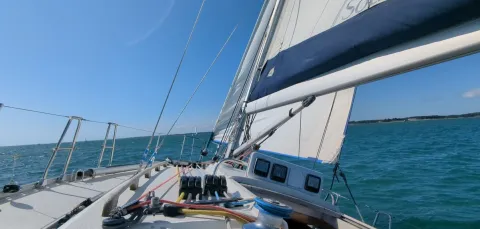 Looking out over the bow of a yacht at sea