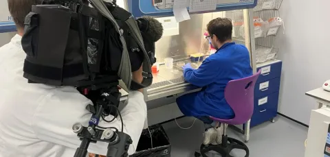 Filming a technician working in a fume cupboard